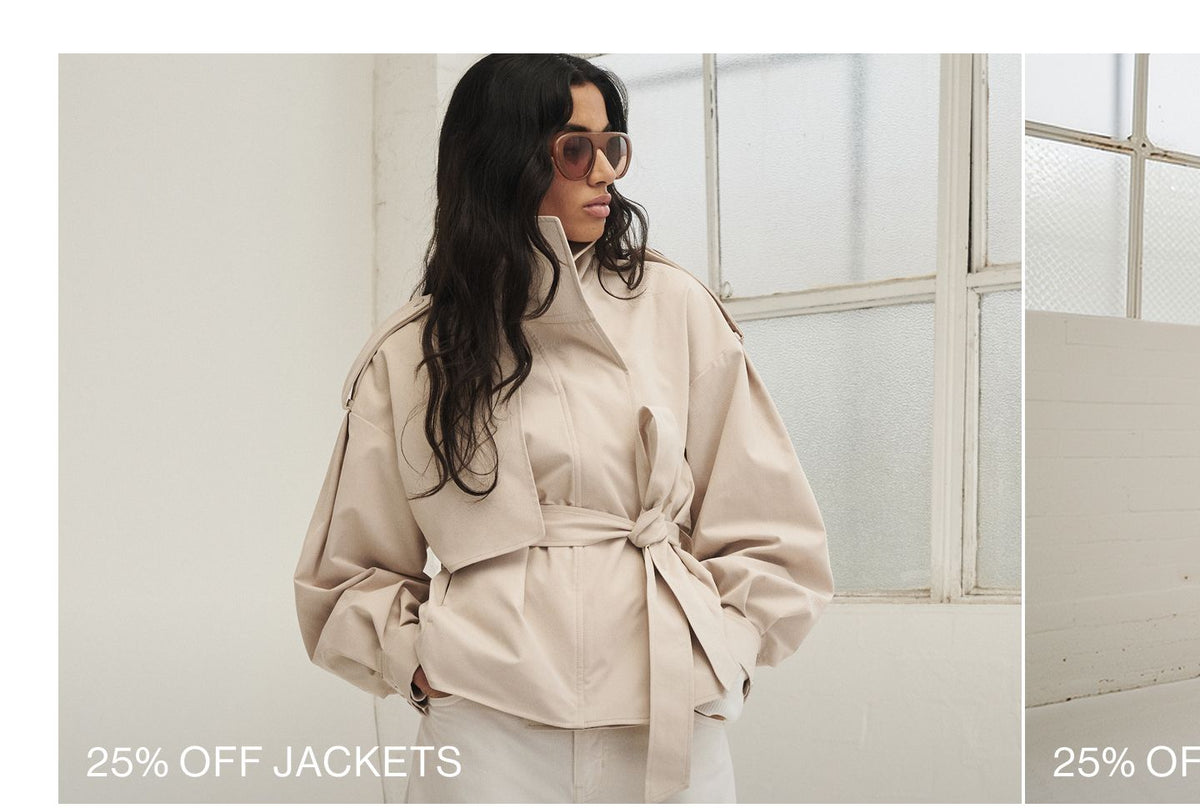 Model posing in a cropped trench with text overlay: "25% OFF JACKETS"